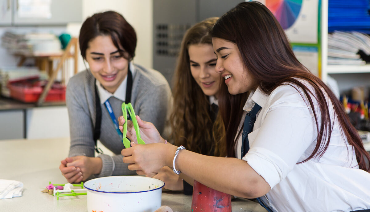Secondary school students engage in an art activity
