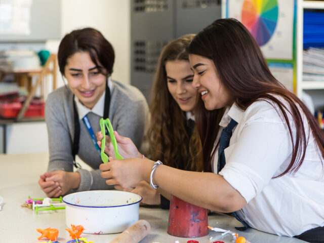 Secondary school students engage in an art activity