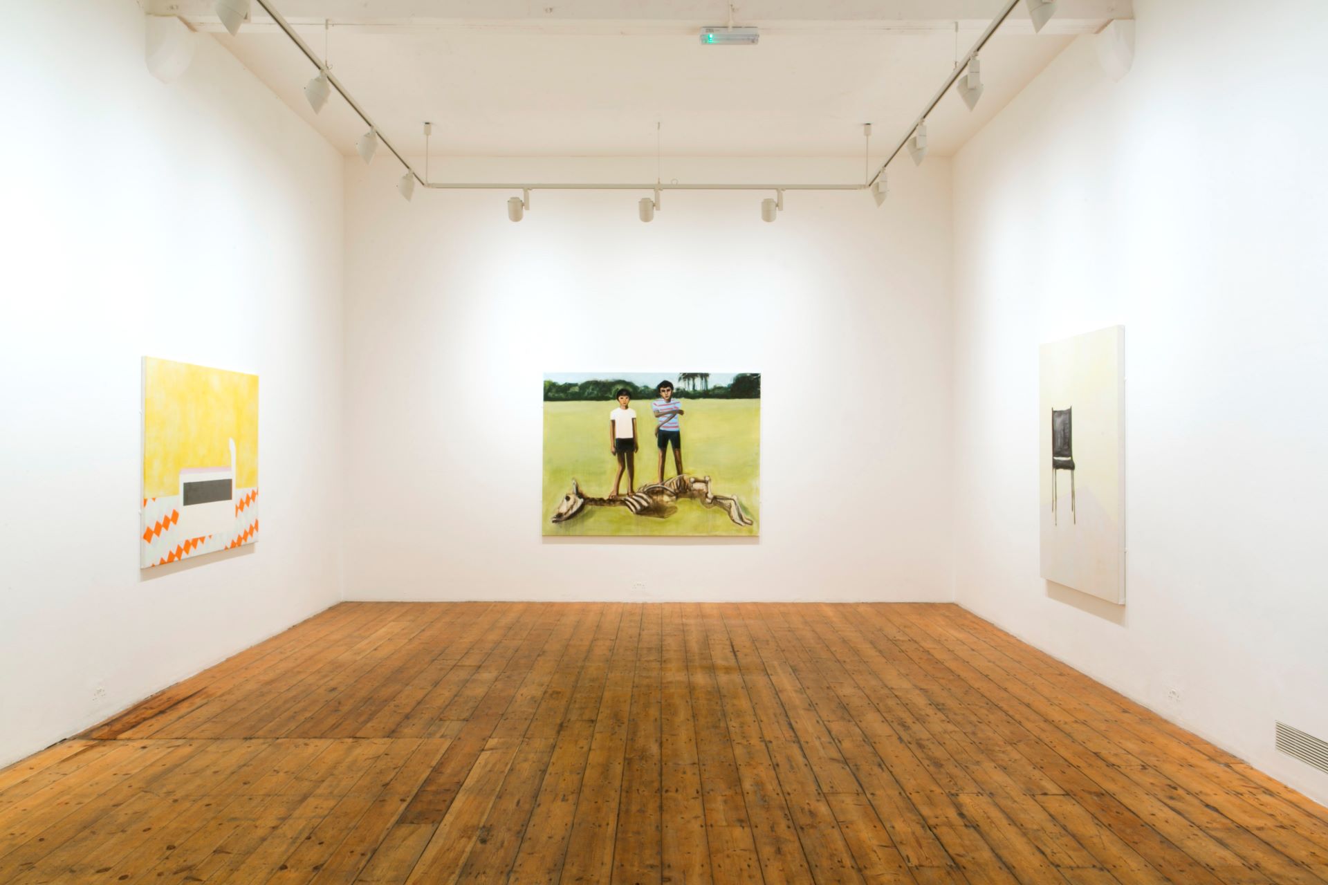 Three paintings on each wall of the Nunnery Gallery