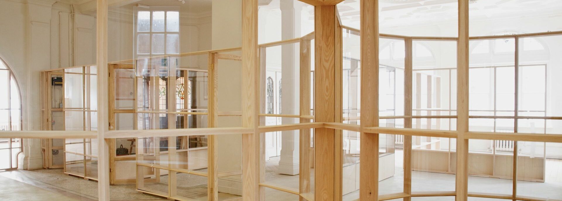Studio spaces are divided by glass partitions