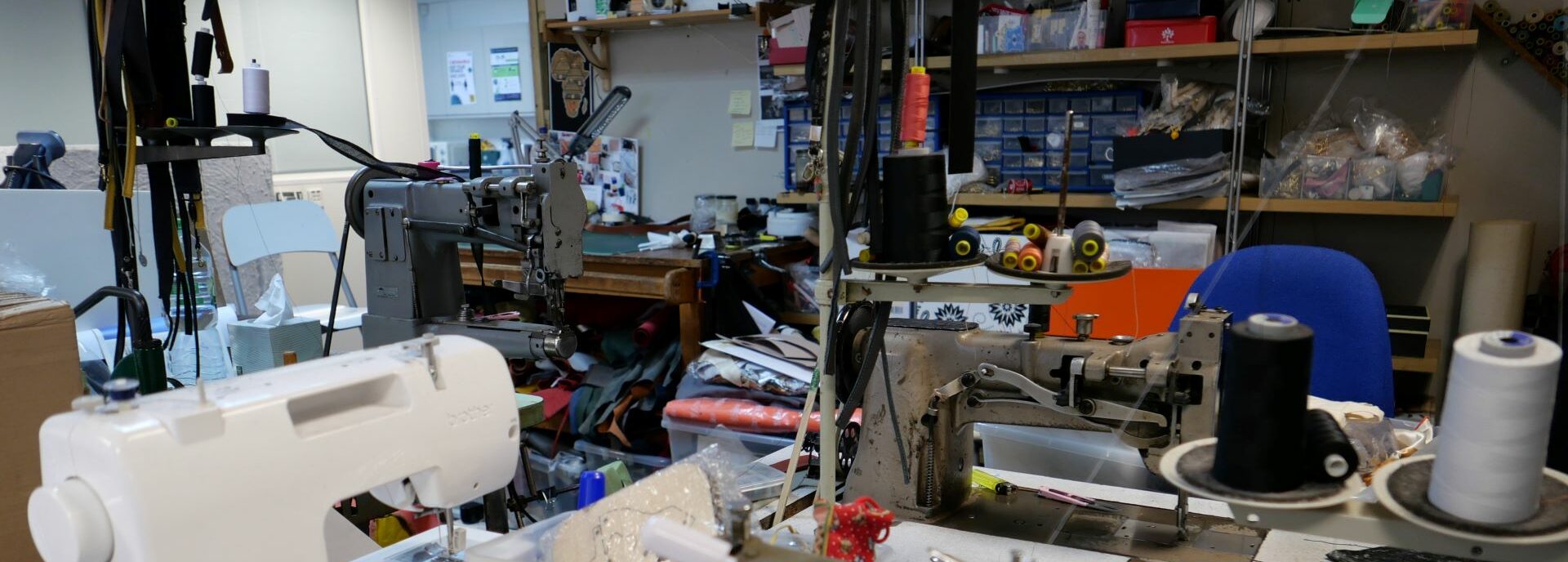 Sewing machines and fabric fill up a studio