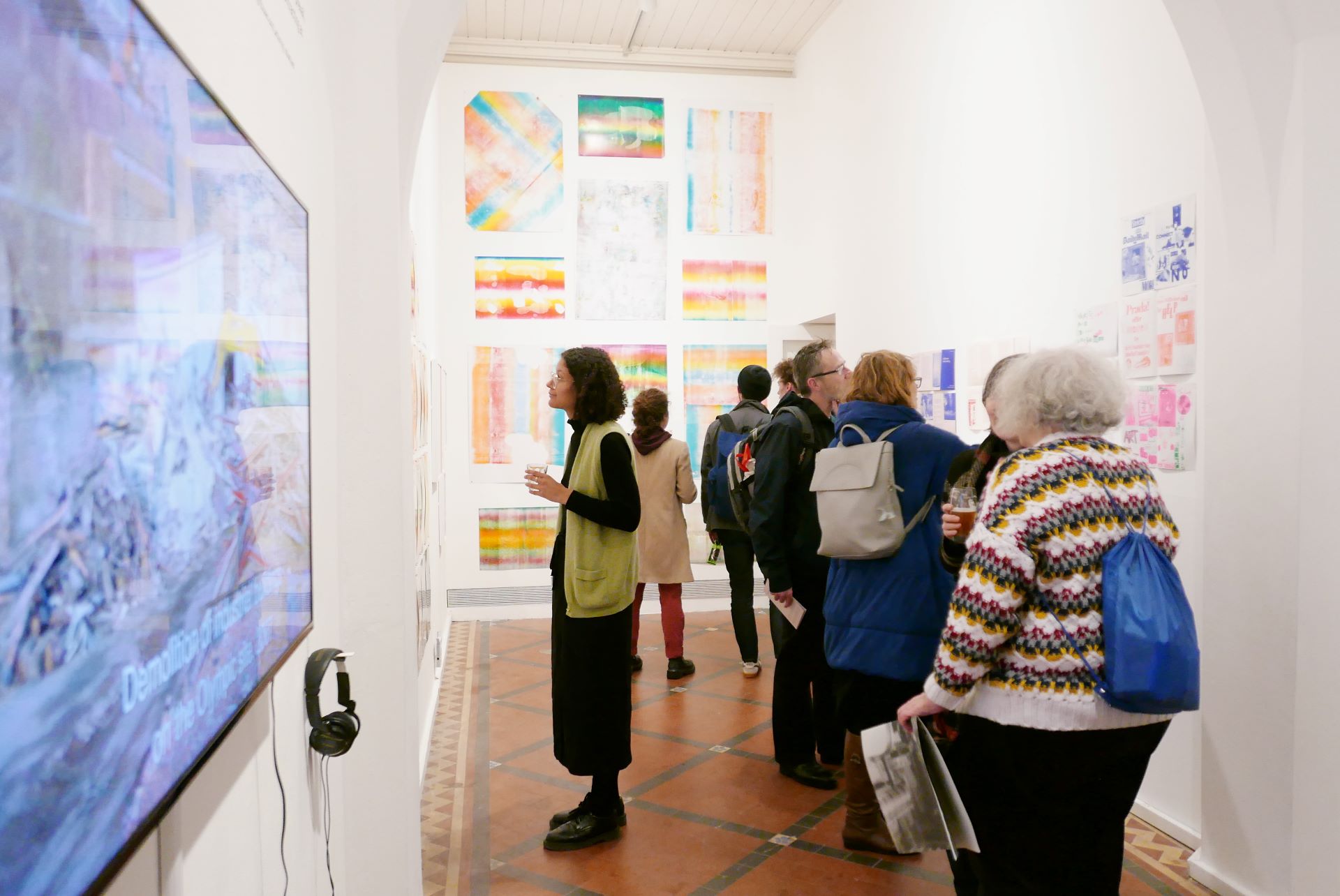 People browse the artwork in the nave space of the nunnery gallery