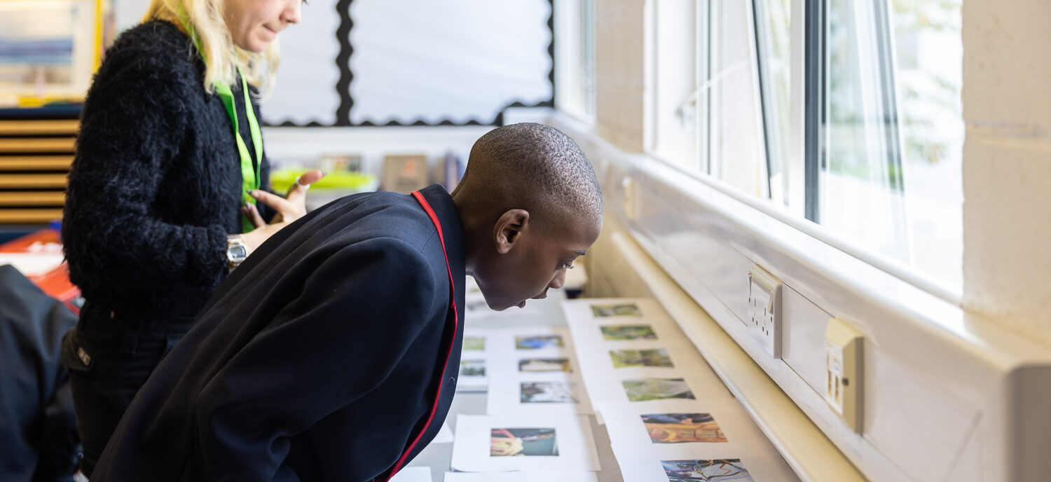 Student looks over photographs