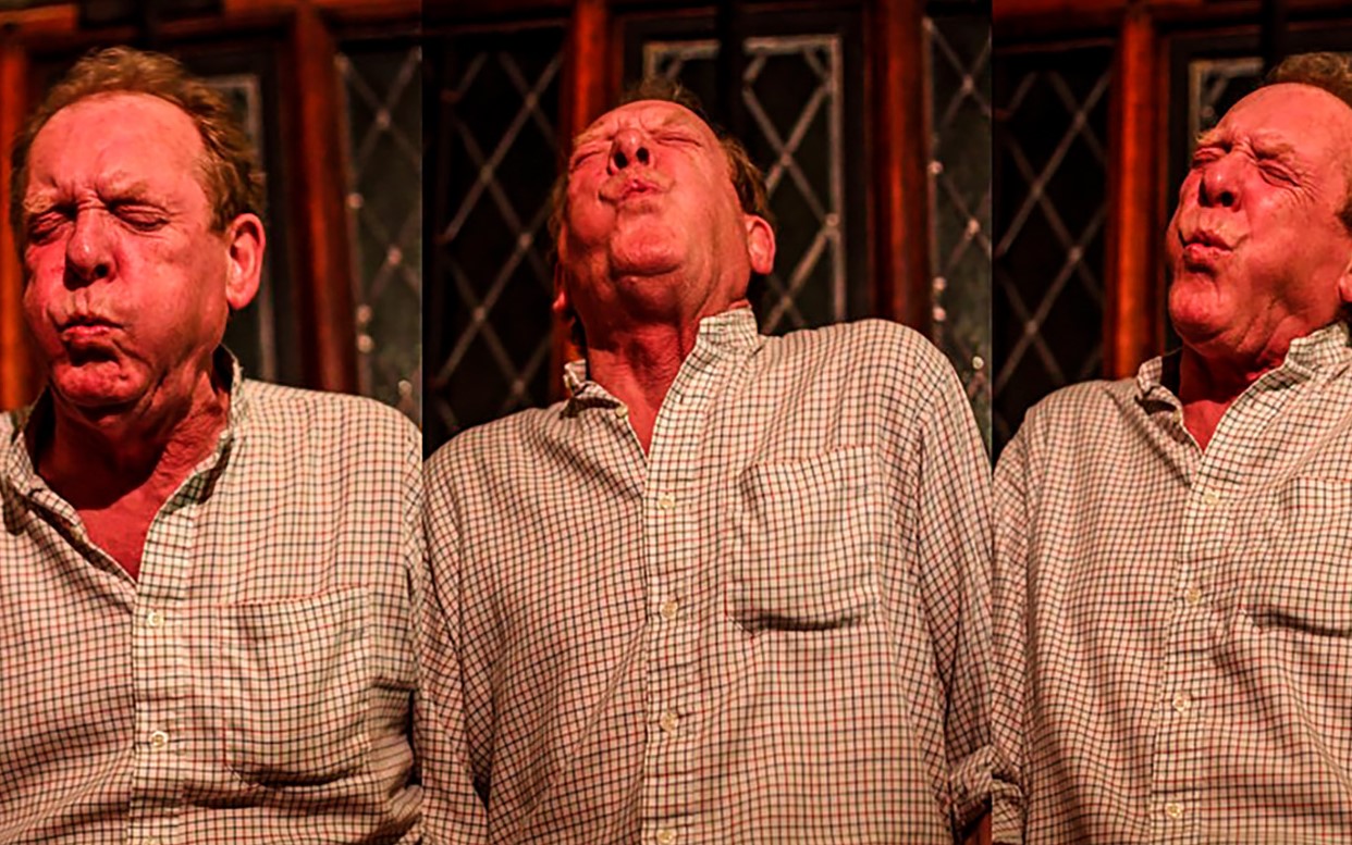 A person pulls faces as he sings for a feral choir