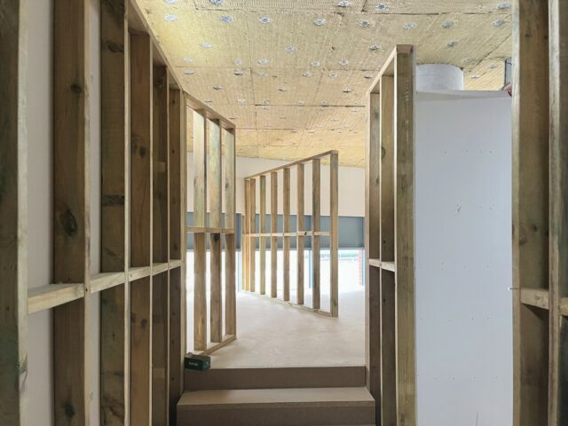 A walkway with studio walls in the process of being put up