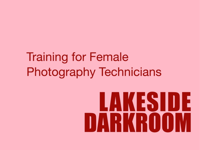 Red on pink background saying Training for female photography technicians