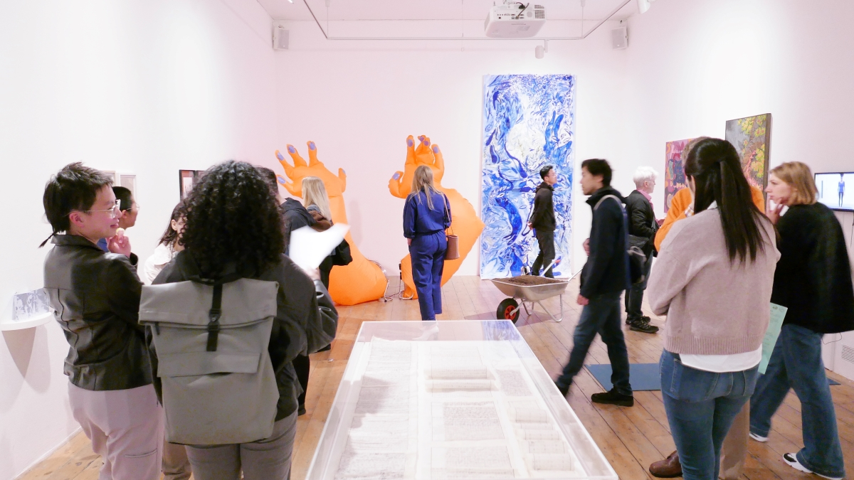 Visitors enjoying Baezianz Bow Open exhibition at the Nunnery Gallery