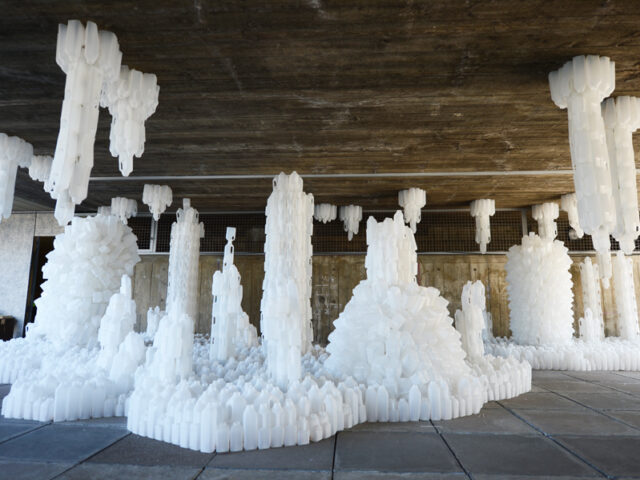 Wastescape: a sculptural city of stalagtites and staglagmites made of milk bottles. By Gayle Chong Kwan