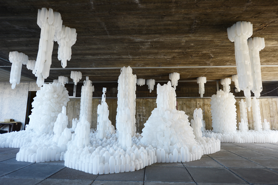 Wastescape: a sculptural city of stalagtites and staglagmites made of milk bottles. By Gayle Chong Kwan