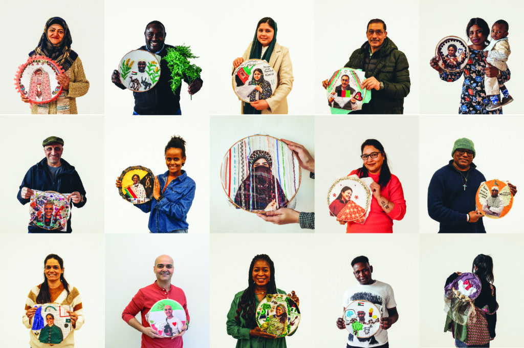 Project participants holding their textile autobiographies. Photo by JC Candanedo