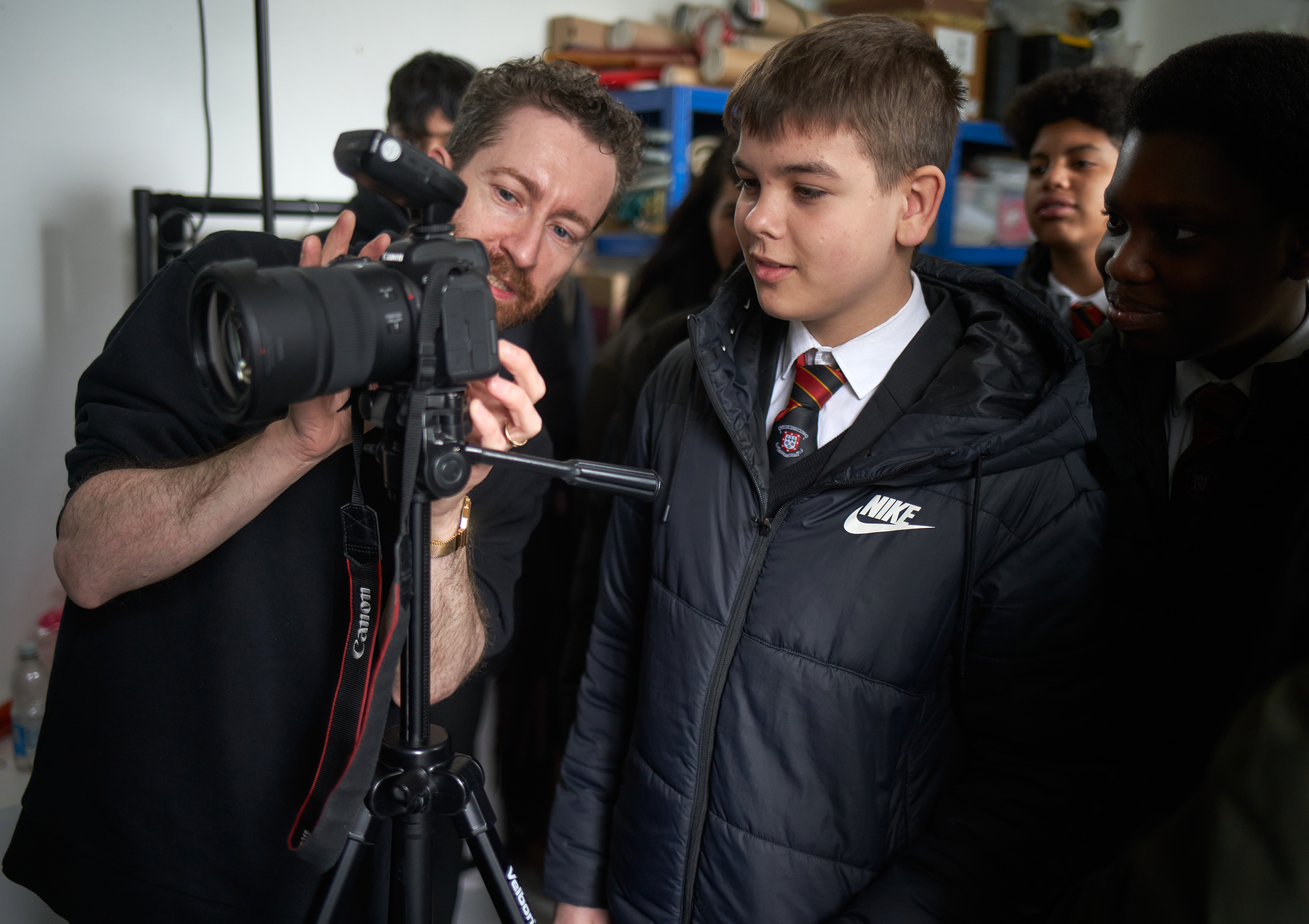 Jonny Bosworth taking photos with students from Barking Abbey School