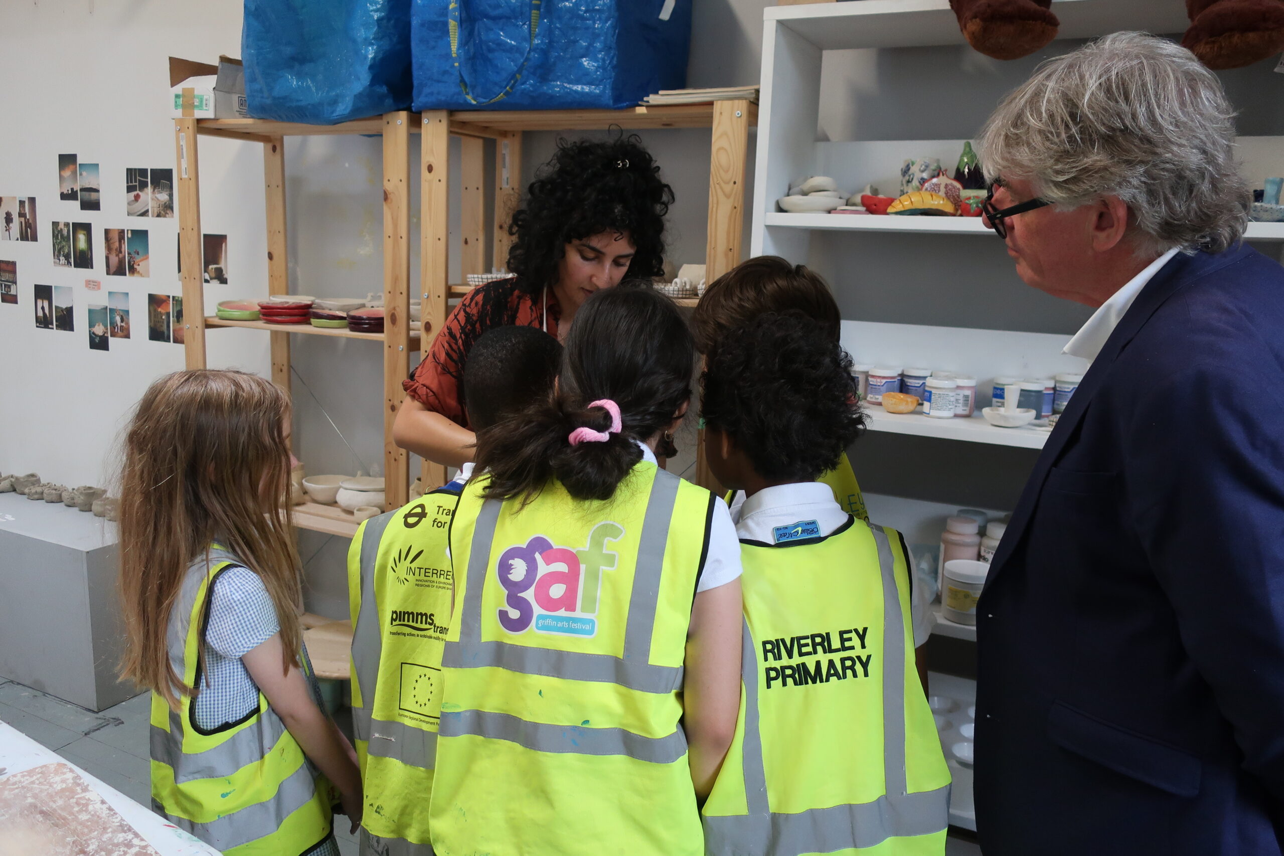 Artist Yasmin Falahat shows students her work