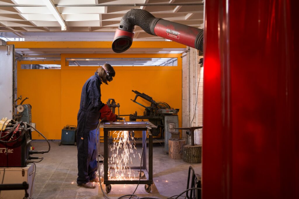 a metalworker at london sculpture workshop